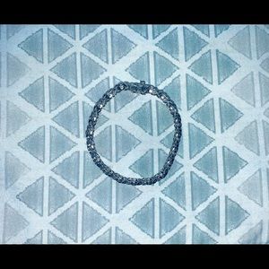 Sterling silver tennis bracelet.